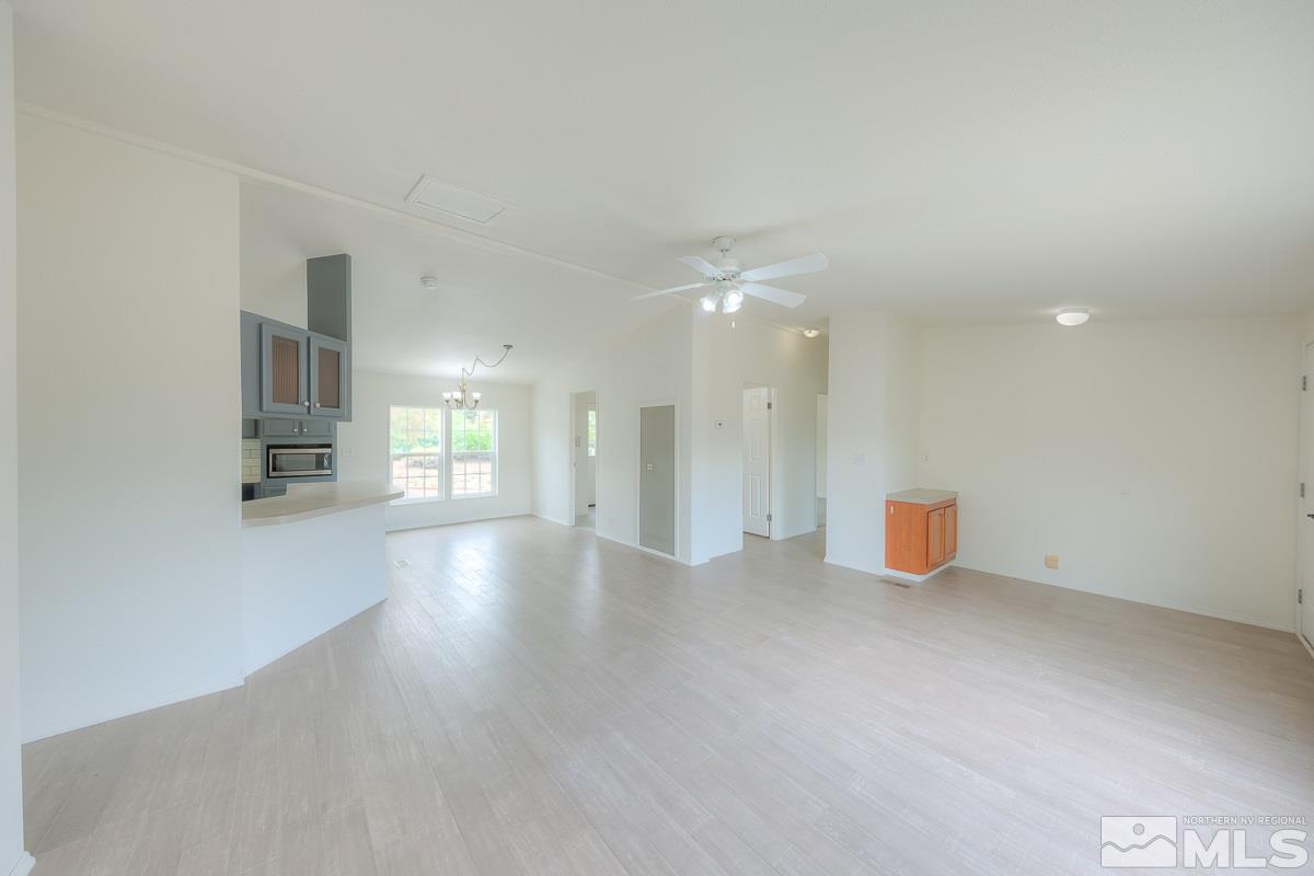 15186 Pinion Drive Reno, NV 89521 - Photo 5 of 20 a view of an empty room with a fireplace