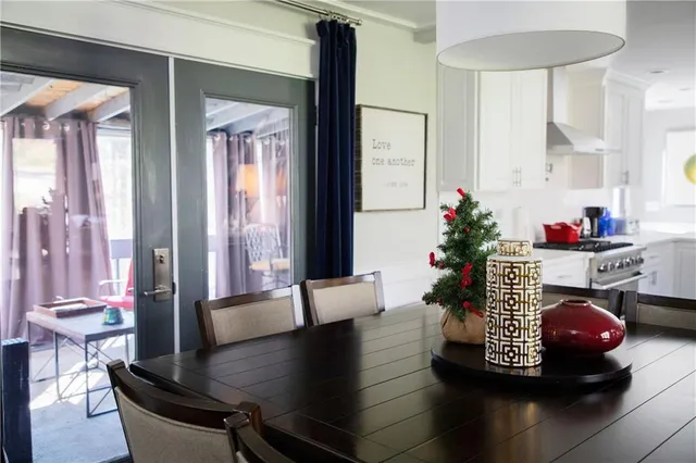 a living room with furniture and flowers