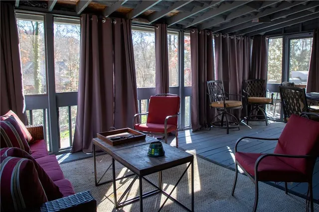 a living room with furniture and a window