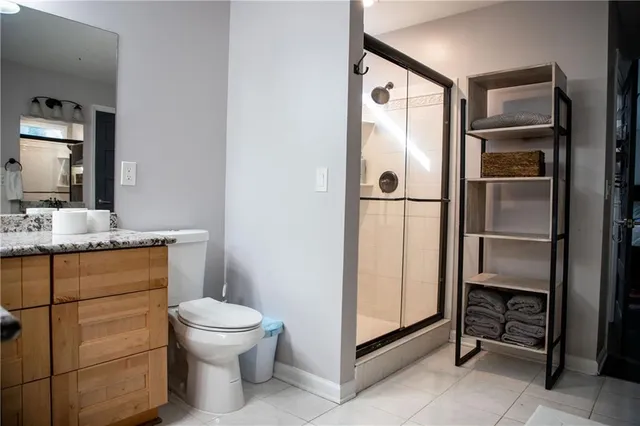 a bathroom with a toilet sink and a mirror