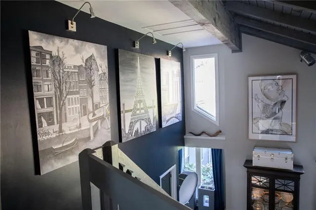 a view of a living room and dining room with furniture