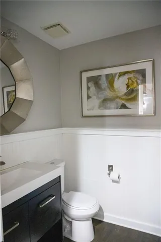 a bathroom with a toilet and a sink