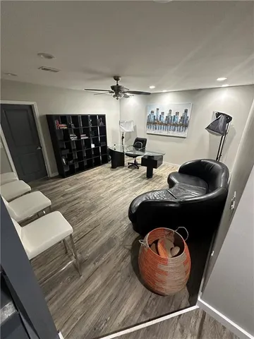 a living room with furniture and a lamp