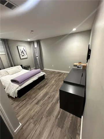 a bedroom with a bed and lamp