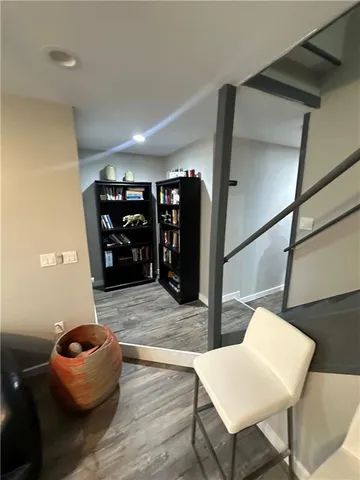 a living room with furniture and entryway