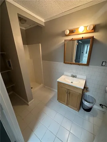 a bathroom with a sink a mirror and a bathtub