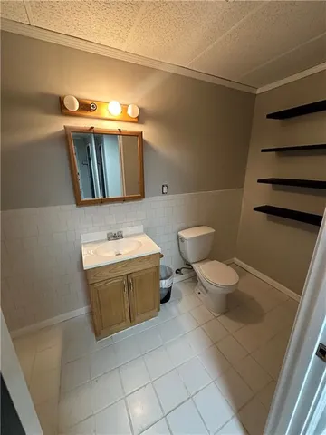 a bathroom with a toilet and a sink