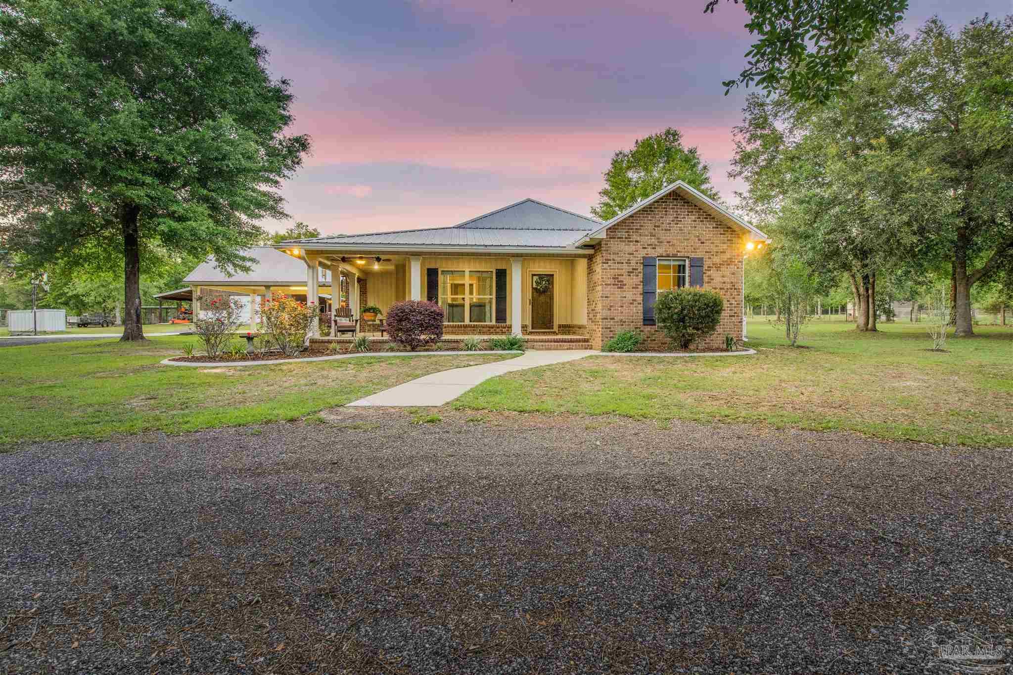 7223 Martin Road Milton, FL 32570 - Photo 1 of 27 a view of a house with a yard