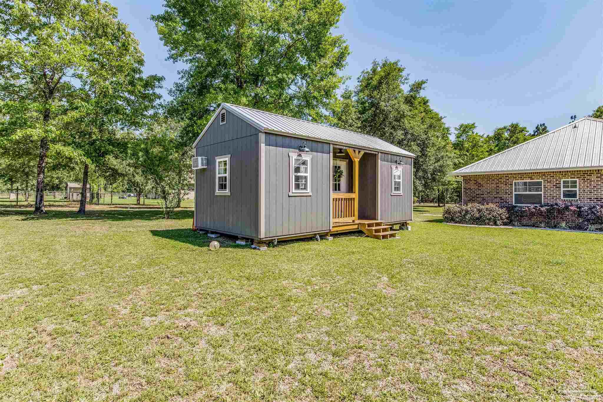 7223 Martin Road Milton, FL 32570 - Photo 24 of 27 a house view with a garden space