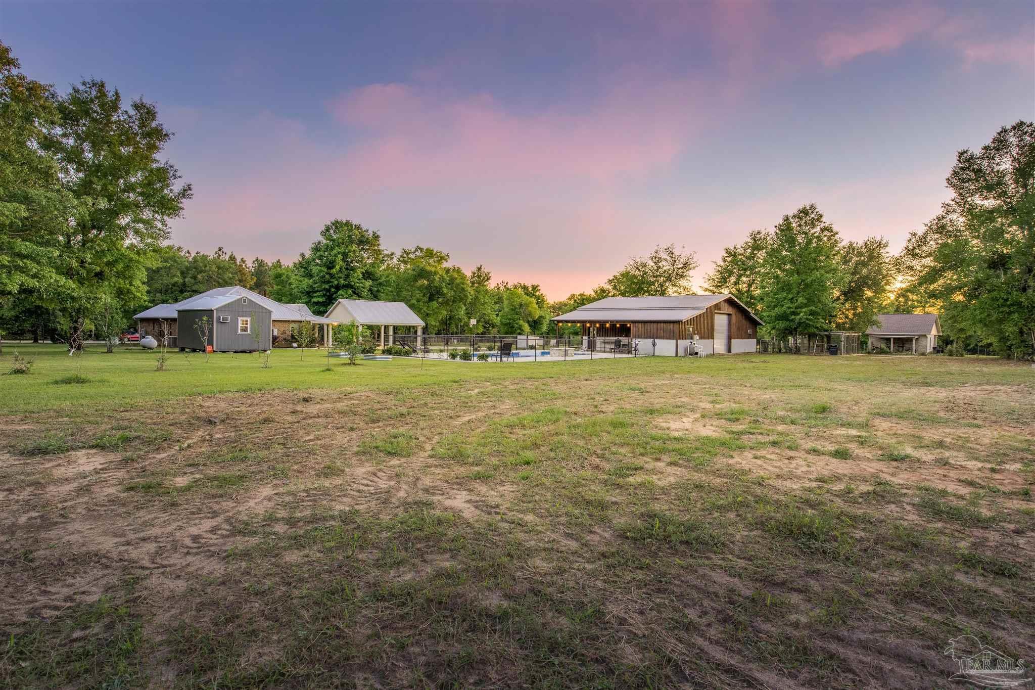 7223 Martin Road Milton, FL 32570 - Photo 27 of 27 a front view of a house with garden