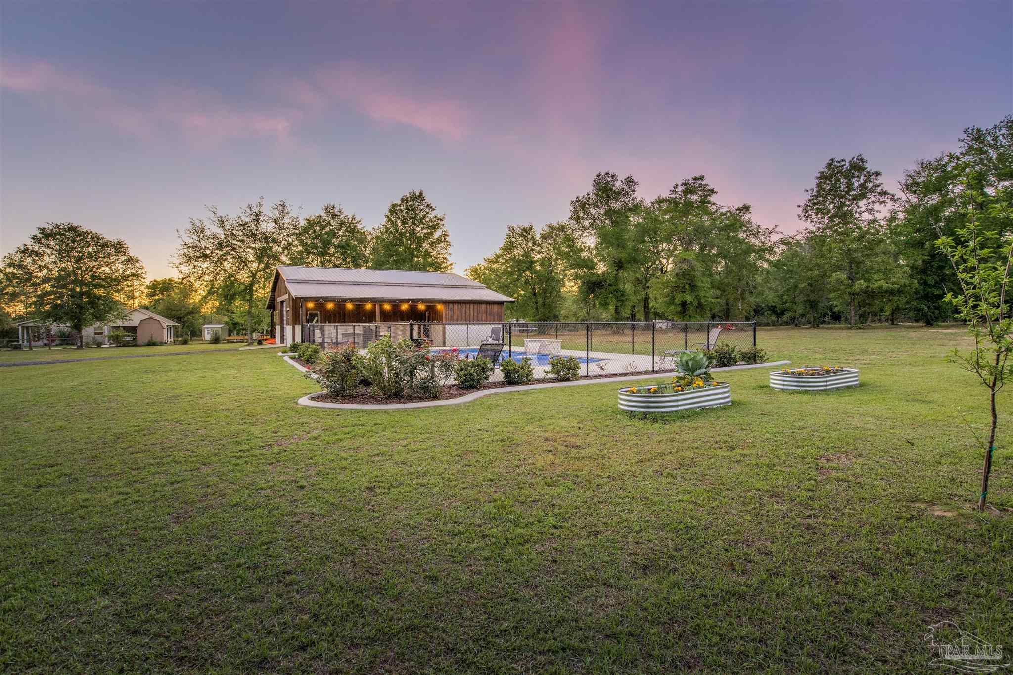 7223 Martin Road Milton, FL 32570 - Photo 9 of 27 a view of a house with a yard