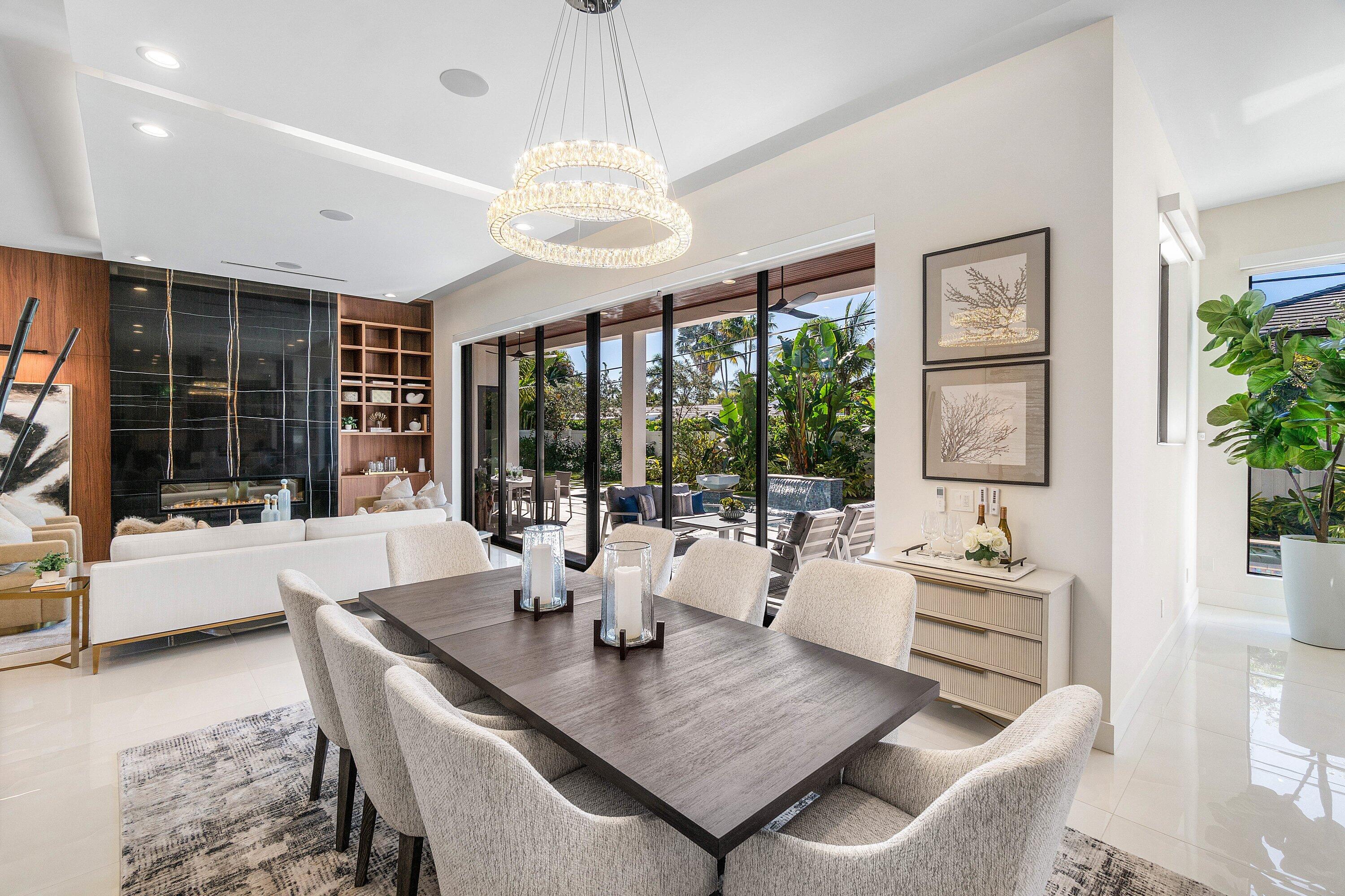 450 Northeast 10th Street Boca Raton, FL 33432 - Photo 20 of 119 a view of a dining room with furniture large windows and wooden floor