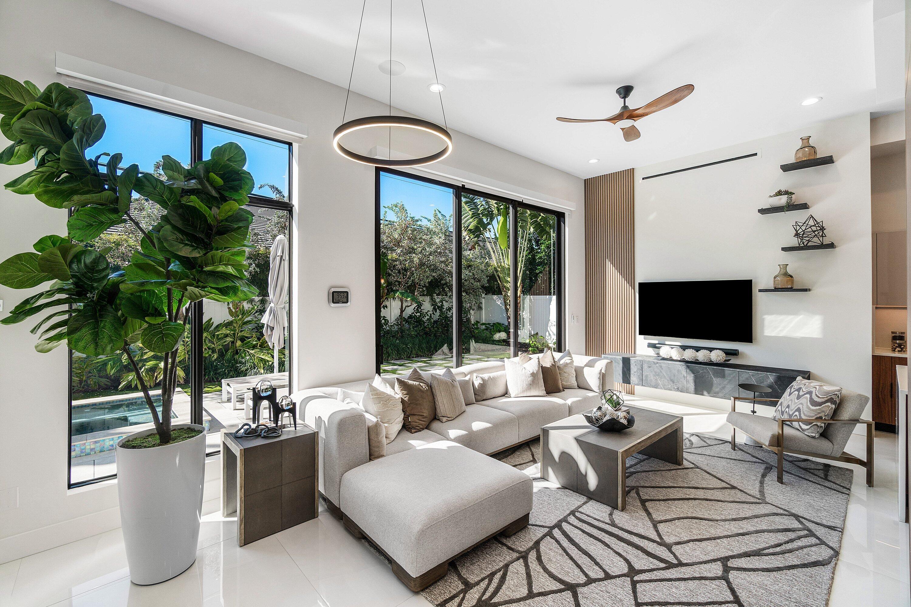 450 Northeast 10th Street Boca Raton, FL 33432 - Photo 21 of 119 a living room with furniture potted plant and a large window