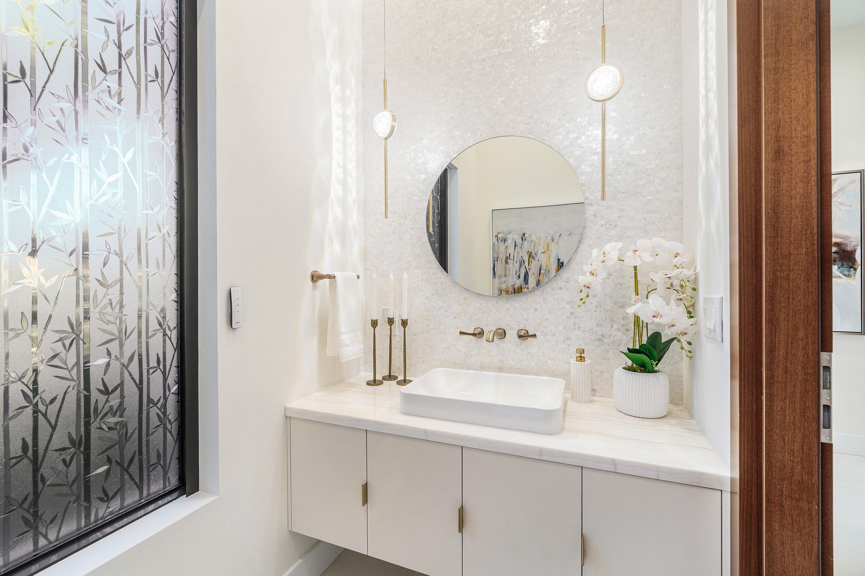450 Northeast 10th Street Boca Raton, FL 33432 - Photo 28 of 119 a bathroom with a sink a mirror and a potted plant