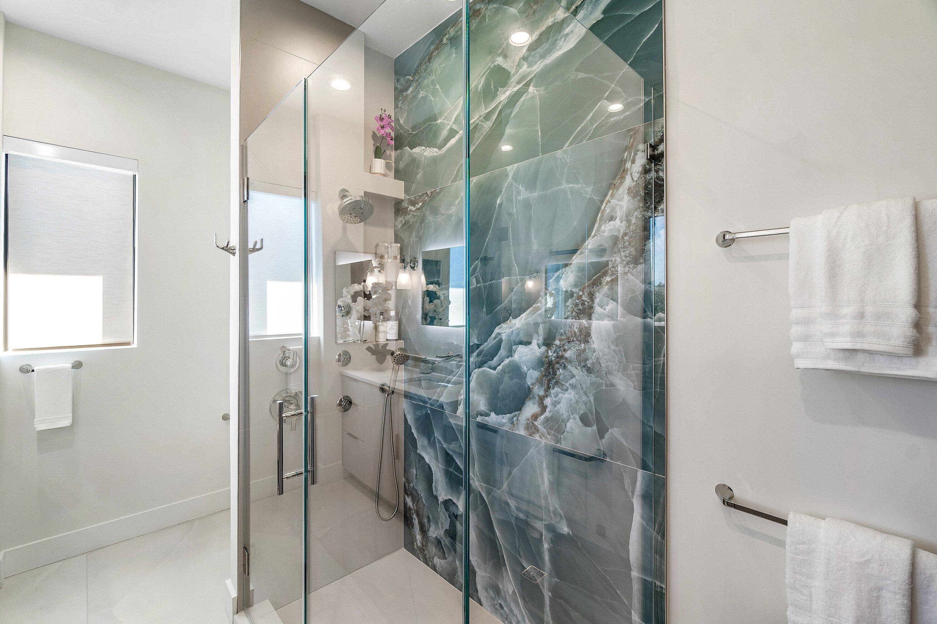 450 Northeast 10th Street Boca Raton, FL 33432 - Photo 49 of 119 a bathroom with a glass shower door and a sink