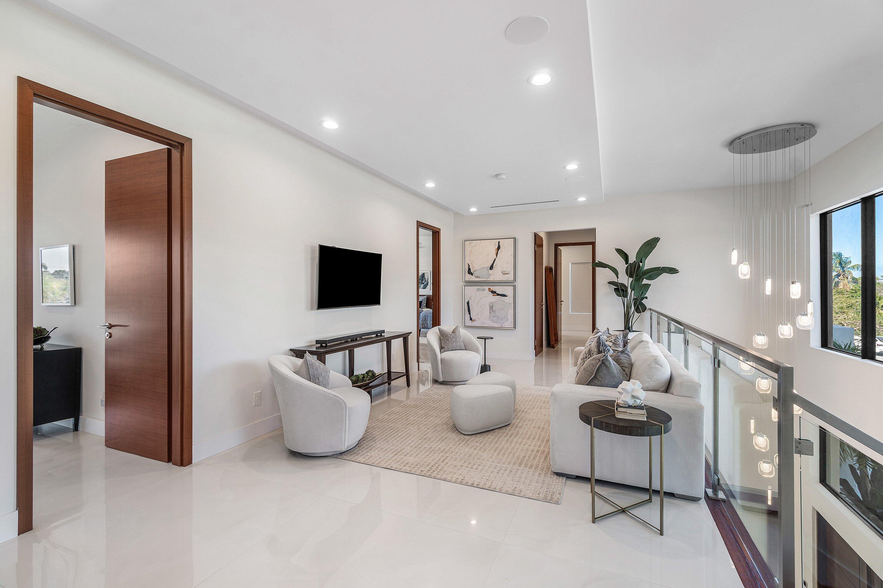 450 Northeast 10th Street Boca Raton, FL 33432 - Photo 50 of 119 a living room with furniture and a flat screen tv