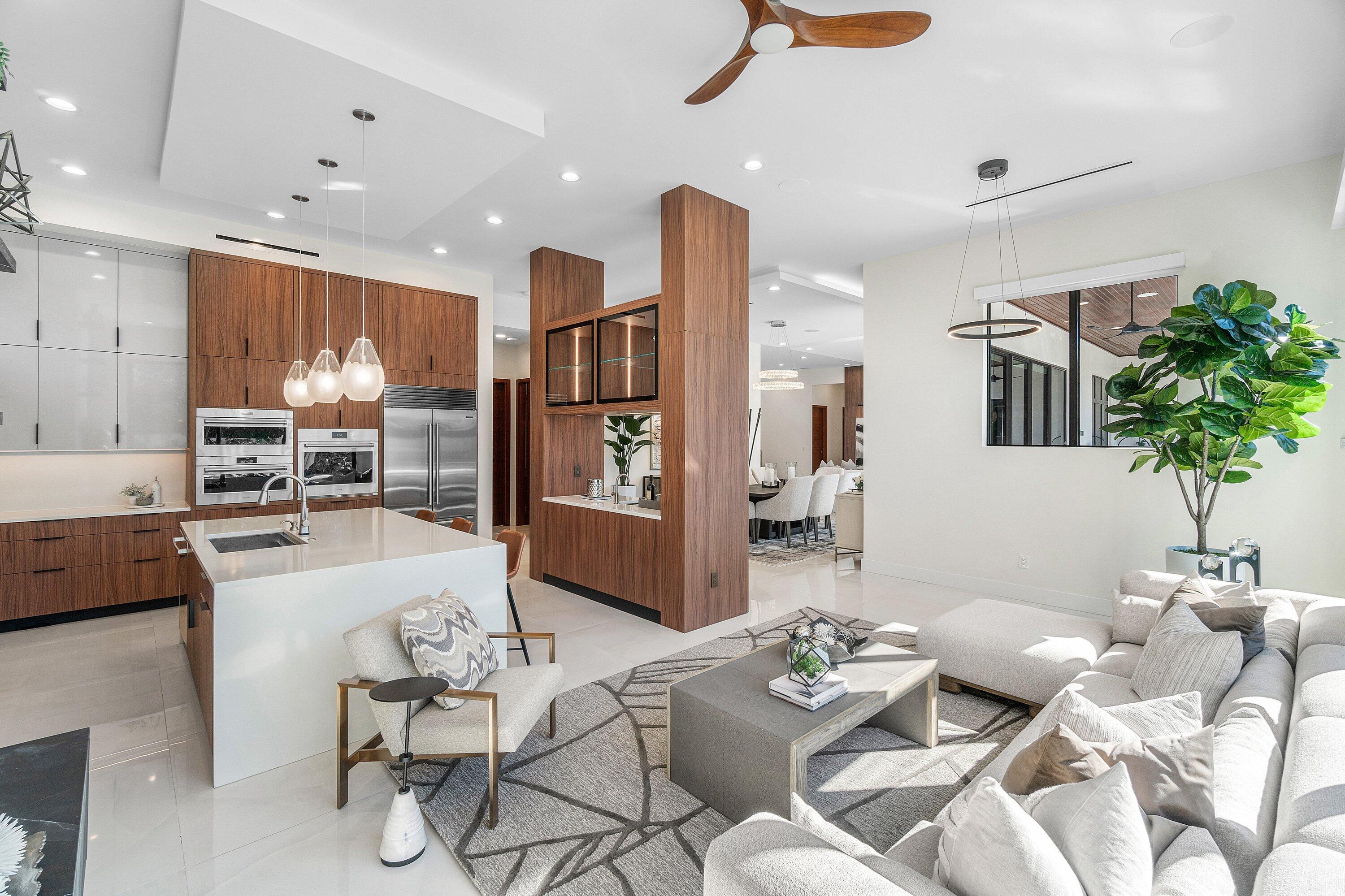450 Northeast 10th Street Boca Raton, FL 33432 - Photo 73 of 119 a living room with furniture and a potted plant