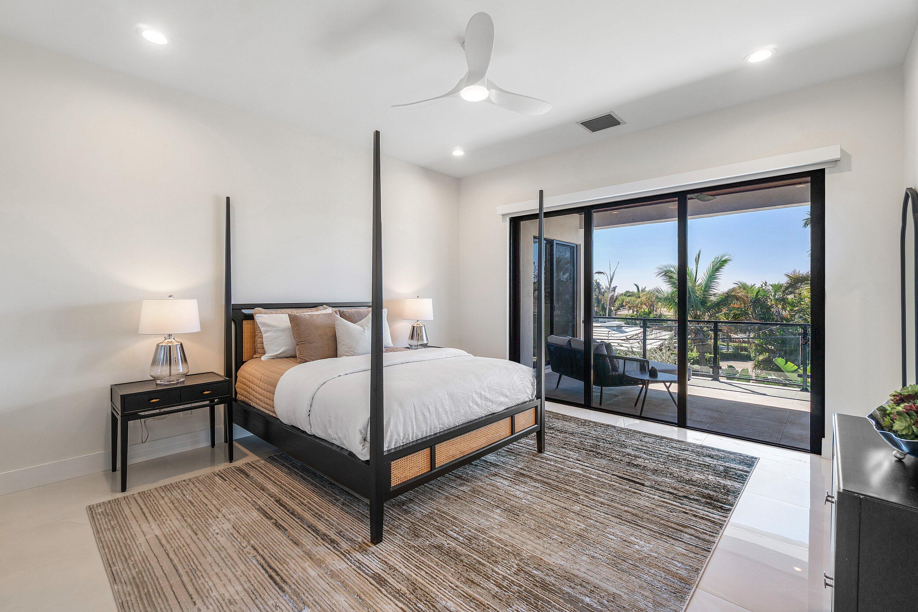 450 Northeast 10th Street Boca Raton, FL 33432 - Photo 95 of 119 a bedroom with a large bed and a large window