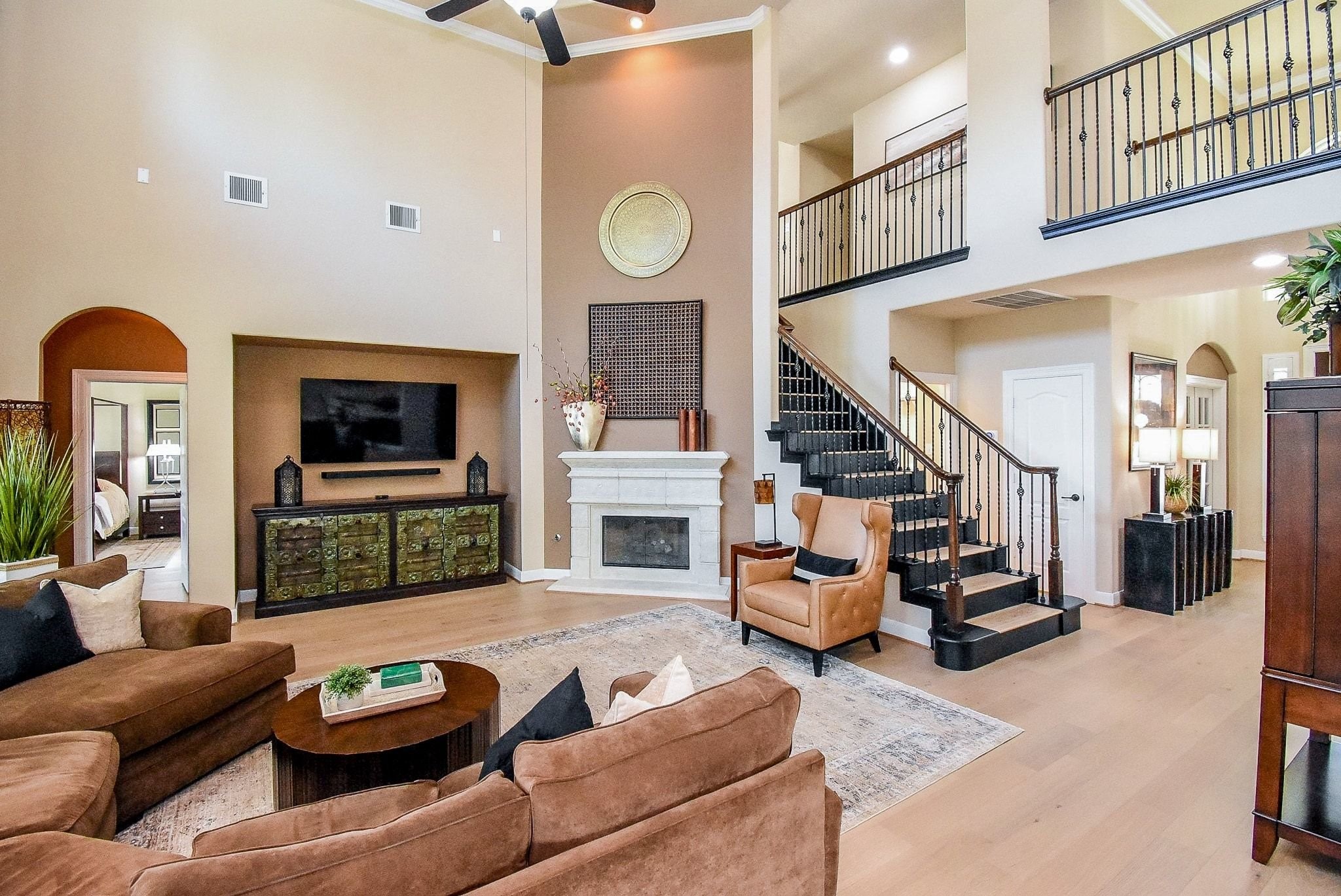 27607 Macklind Ridge Lane Katy, TX 77494 - Photo 20 of 50 18 ft ceilings in the family room. Inset for entertainment equipment. Cast stone fireplace with gaslogs.