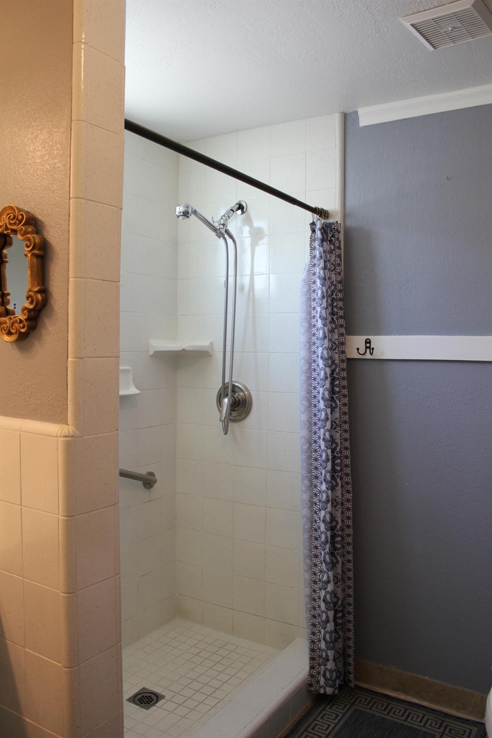 331 North 6th Street Fowler, CA 93625 - Photo 19 of 31 a bathroom with a shower