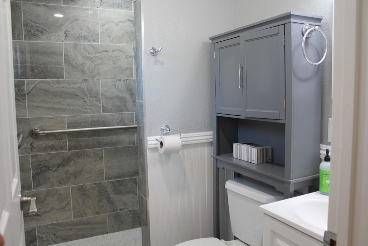 331 North 6th Street Fowler, CA 93625 - Photo 20 of 31 a bathroom with a toilet and a shower