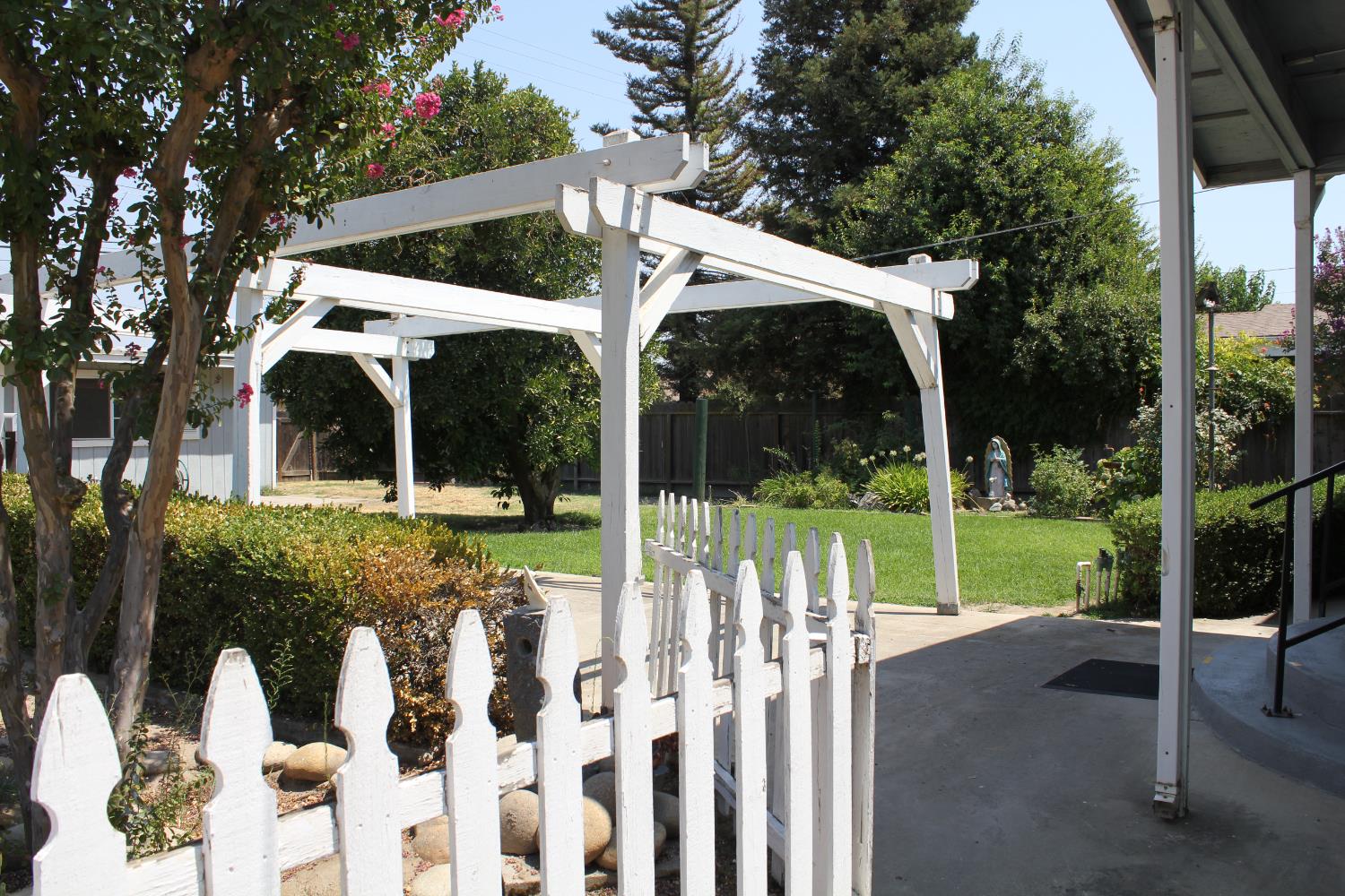 331 North 6th Street Fowler, CA 93625 - Photo 24 of 31 a view of a house with backyard and porch