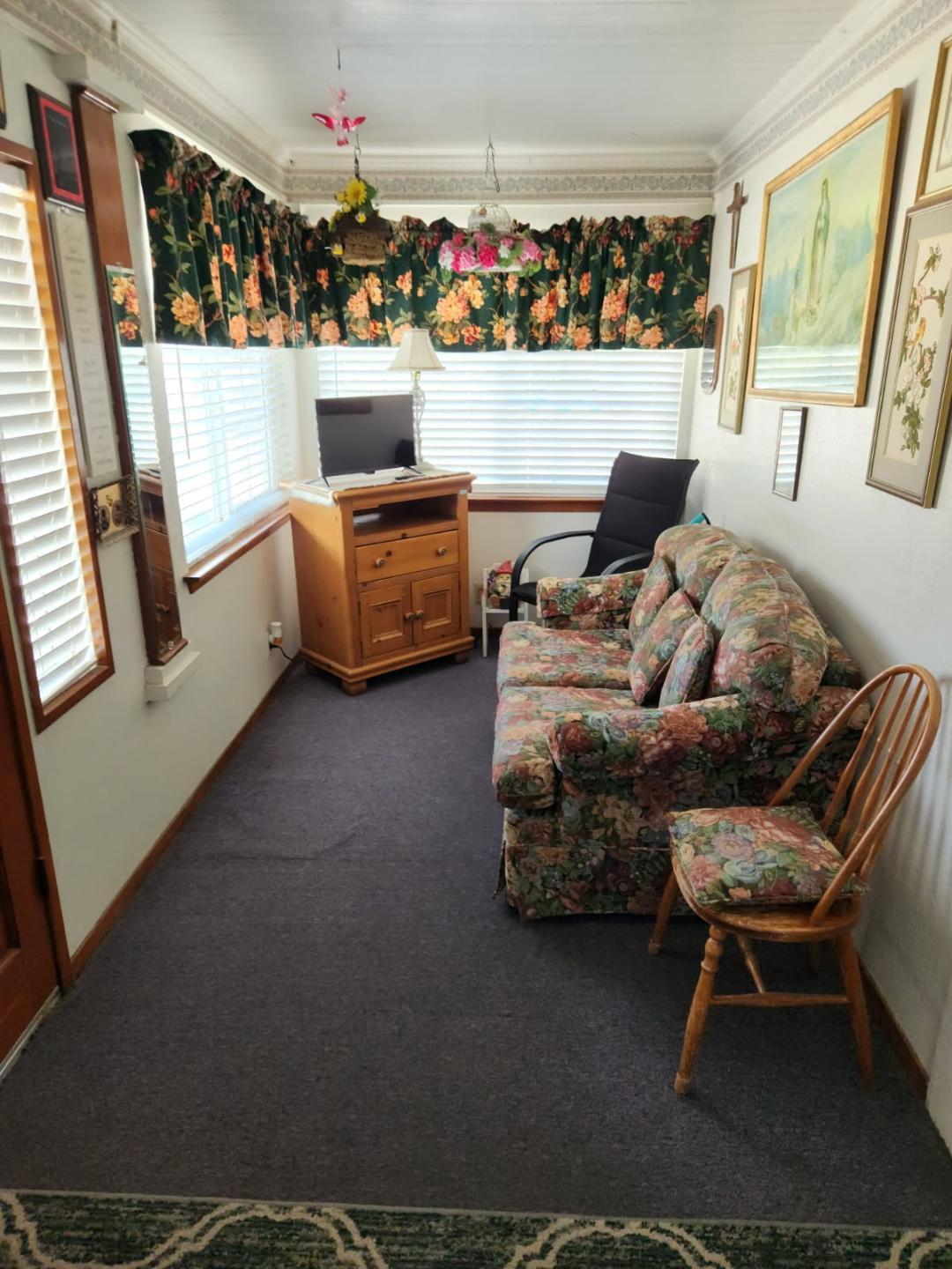 331 North 6th Street Fowler, CA 93625 - Photo 27 of 31 a living room with furniture and a flat screen tv