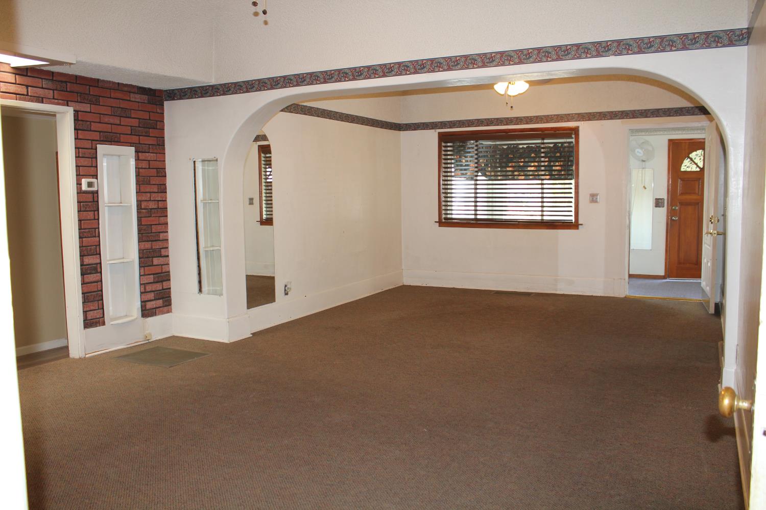 331 North 6th Street Fowler, CA 93625 - Photo 5 of 31 a view of an empty room with a window