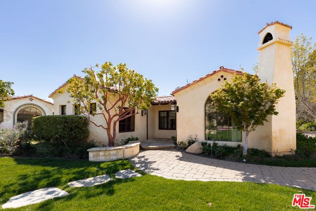 a view of an entryway with hardwood and door