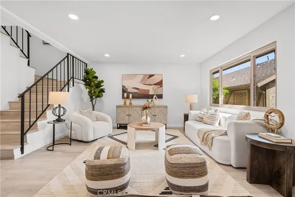 a living room with furniture and a large window