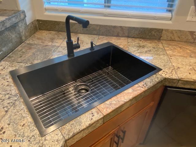 3657 East Hyatt Lane Gilbert, AZ 85295 - Photo 3 of 8 a close view of kitchen sink and stove