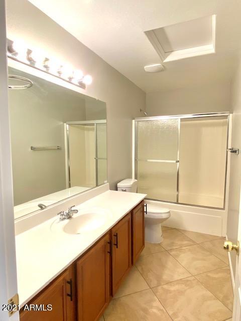 3657 East Hyatt Lane Gilbert, AZ 85295 - Photo 8 of 8 a bathroom with a sink a toilet and mirror