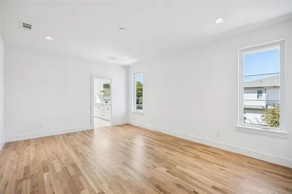 an empty room with wooden floor
