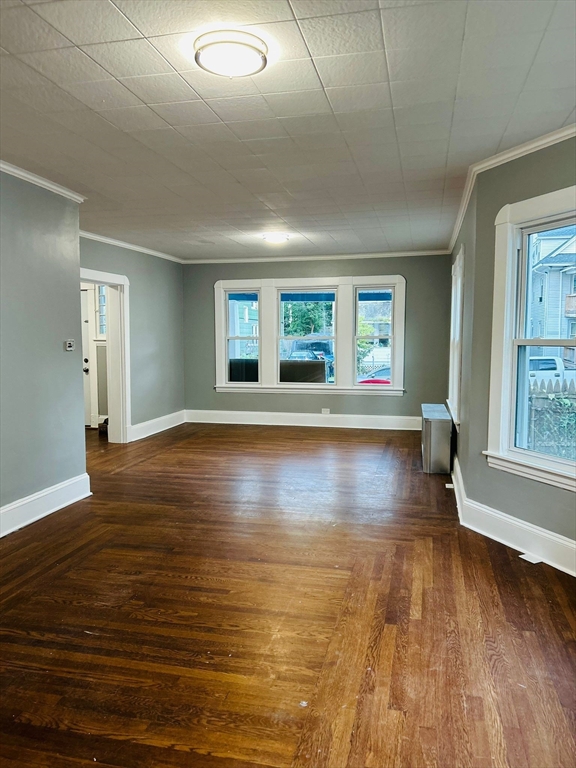 44 Virginia Street, Unit 1 Springfield, MA 01108 - Photo 1 of 13 an empty room with wooden floor and windows