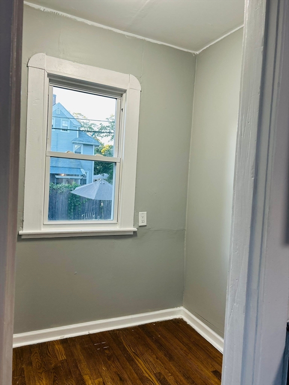 44 Virginia Street, Unit 1 Springfield, MA 01108 - Photo 6 of 13 a view of a small space with wooden floor and a window