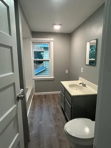 a bathroom with a sink and mirror
