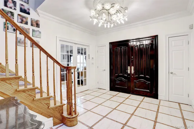 a view of an entryway with wooden floor and staircase