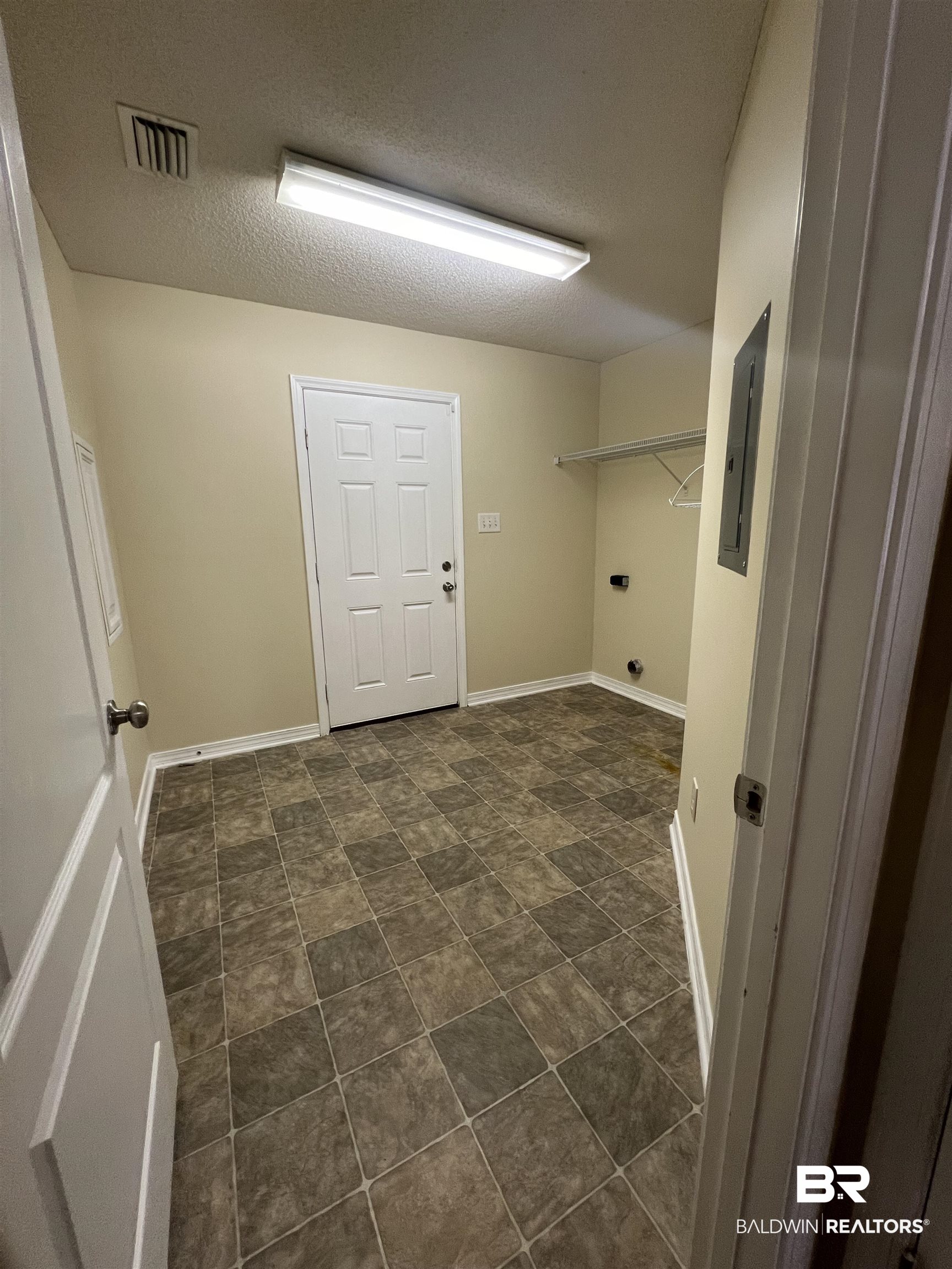 17793 Fancy Boulevard Foley, AL 36535 - Photo 9 of 34 Clothes washing area featuring electric panel and a textured ceiling