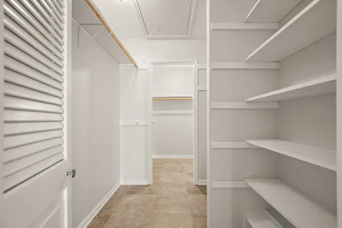 a view of an empty walk in closet