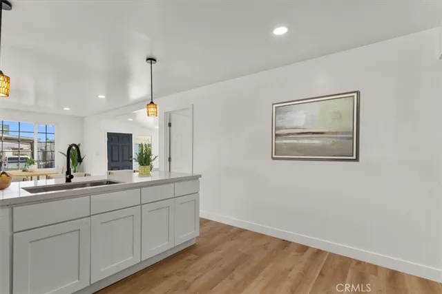 a kitchen with a sink and cabinets