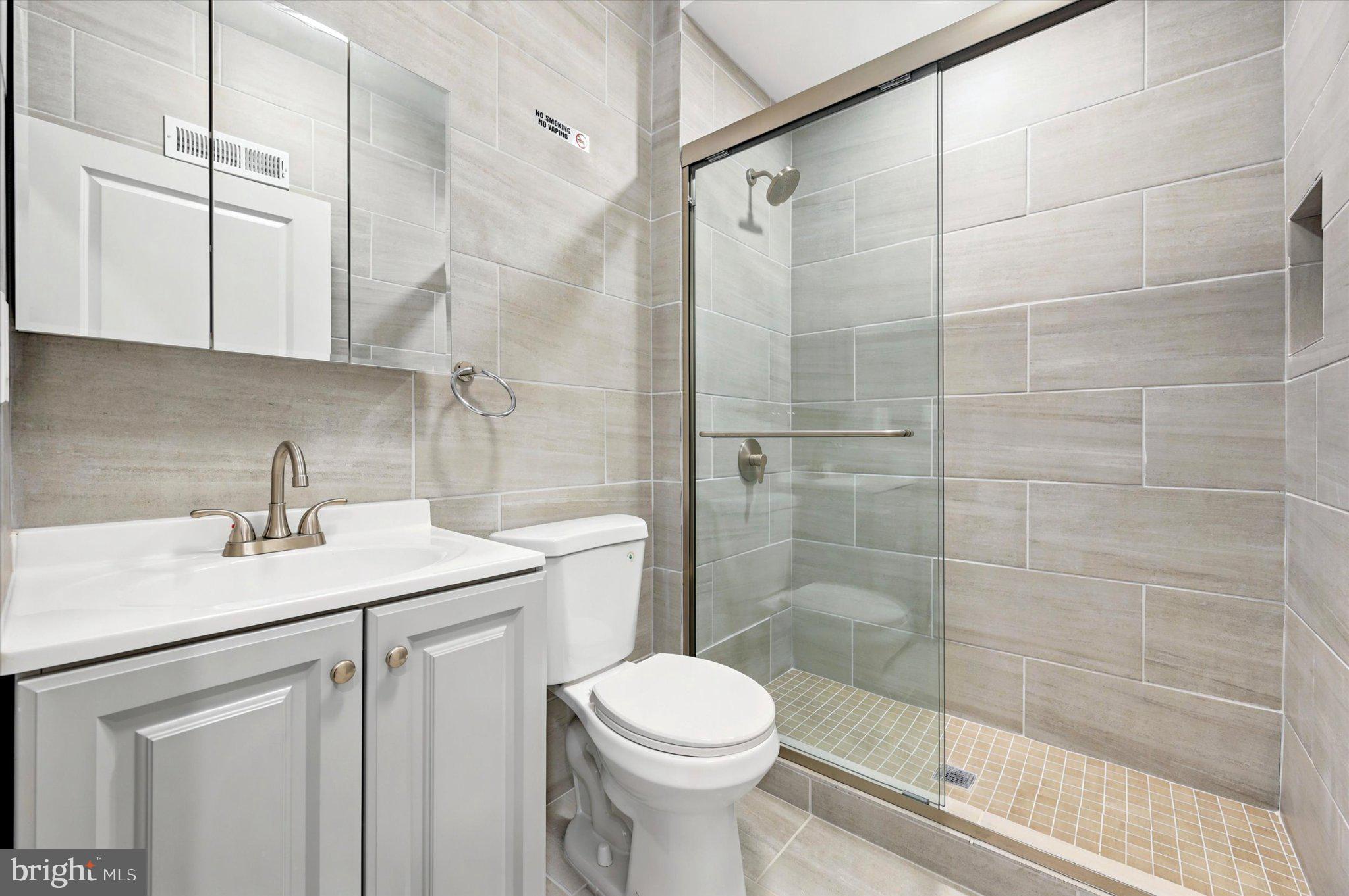 514 Ryers Avenue, Unit A Cheltenham, PA 19012 - Photo 17 of 18 Sleek modern bathroom with glass shower.