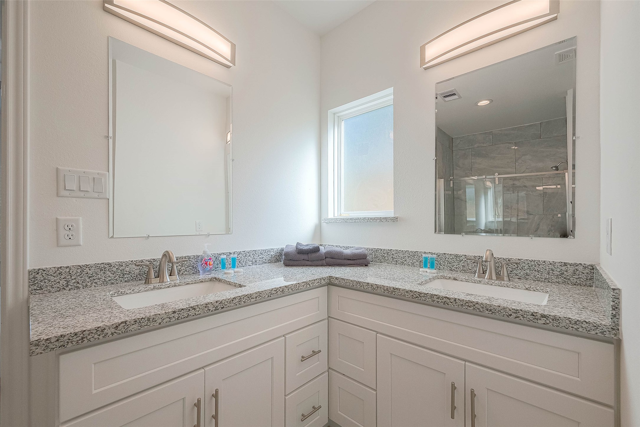 4633 Larkspur Street Houston, TX 77051 - Photo 11 of 48 a bathroom with a granite countertop sink double and mirror
