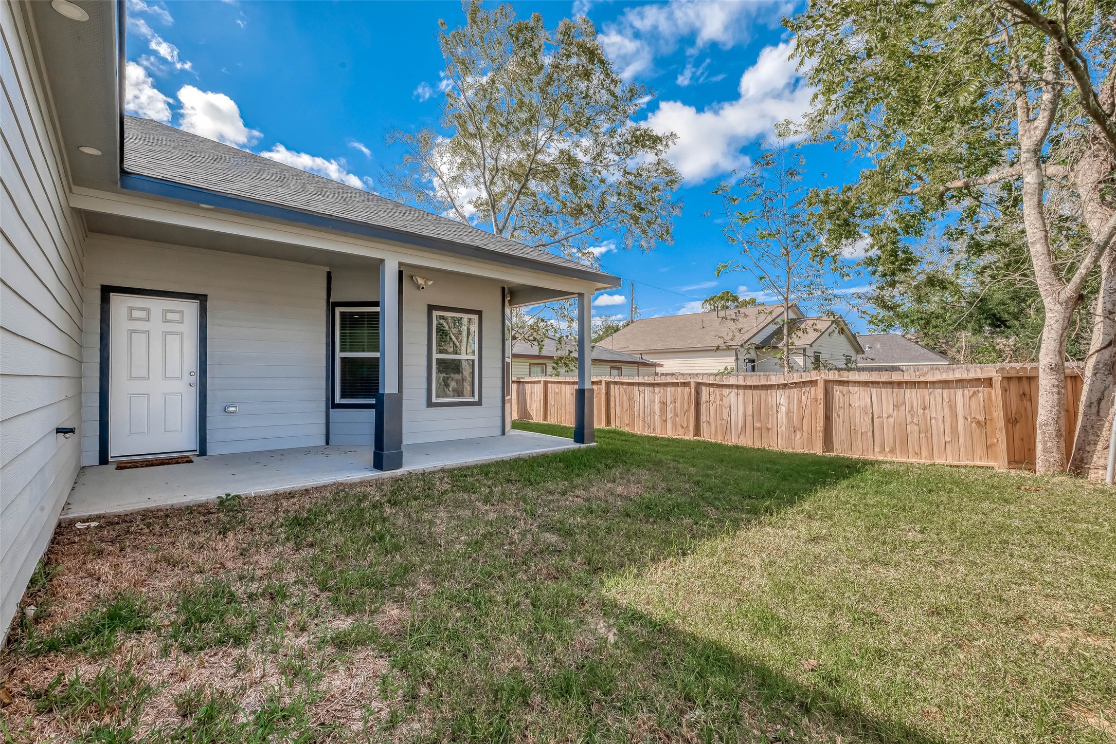 4633 Larkspur Street Houston, TX 77051 - Photo 17 of 48 a view of backyard with a garden and deck