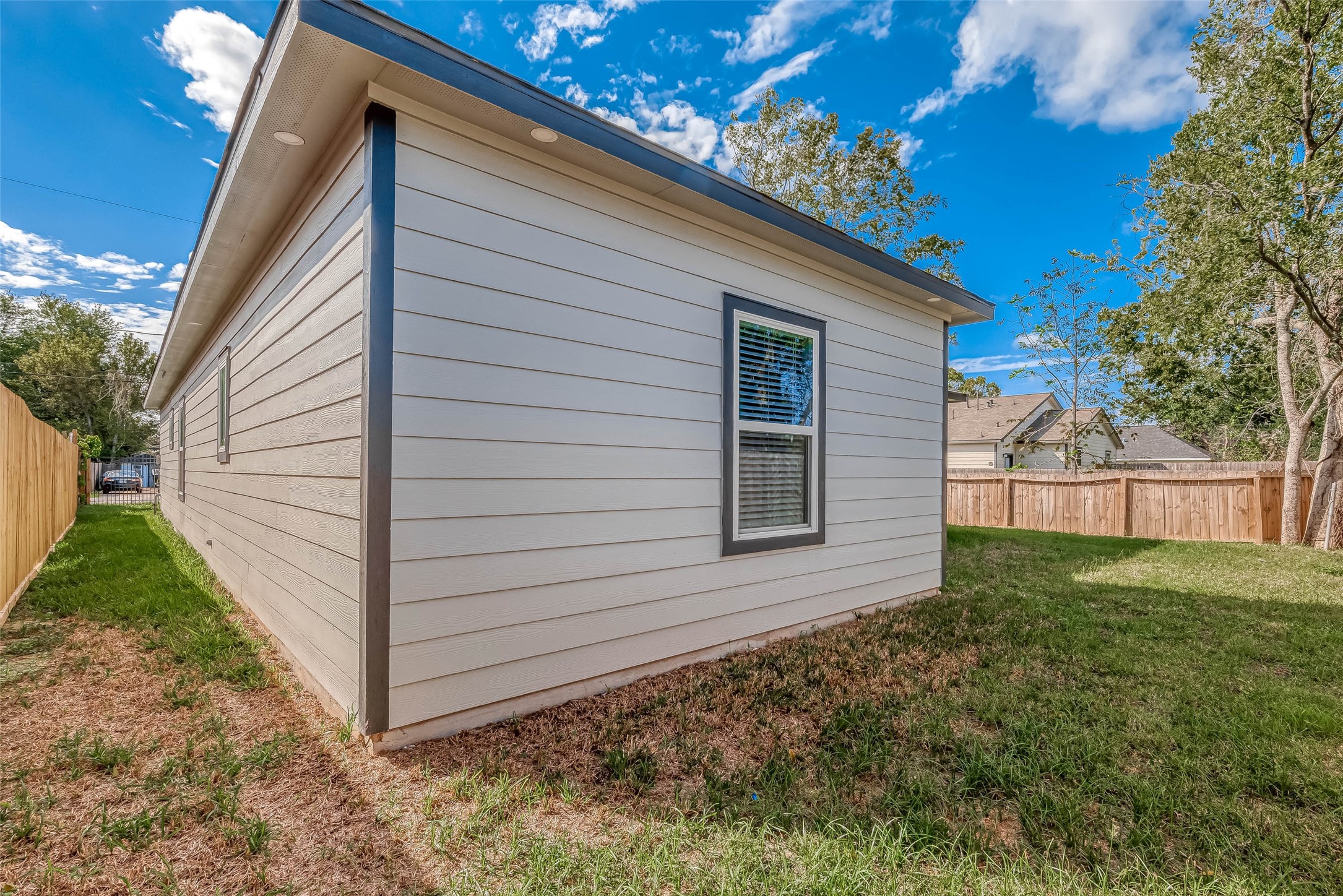 4633 Larkspur Street Houston, TX 77051 - Photo 20 of 48 a view of a backyard with plants and large tree