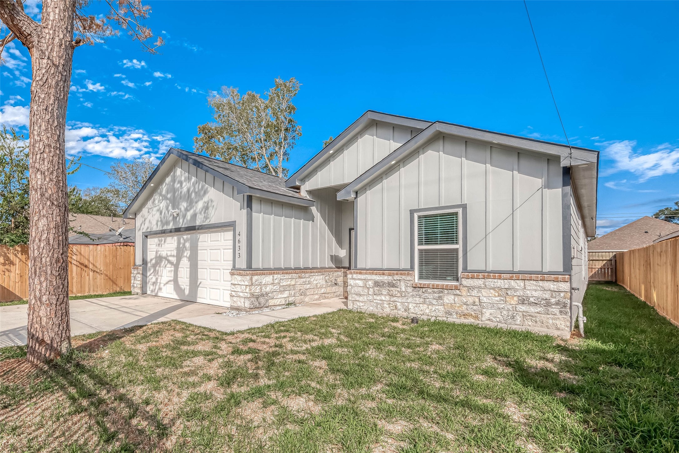 4633 Larkspur Street Houston, TX 77051 - Photo 22 of 48 a house with trees in the background