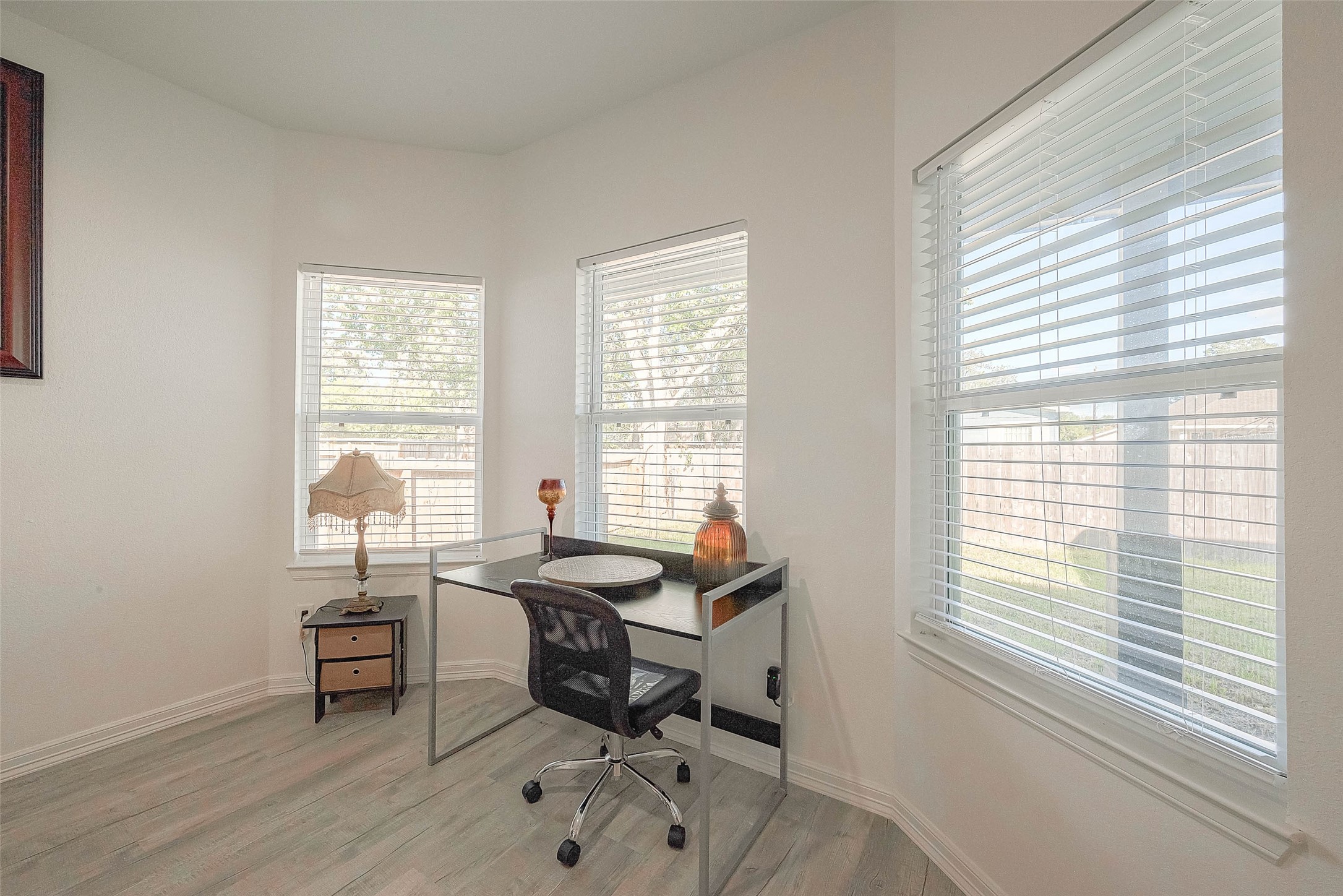 4633 Larkspur Street Houston, TX 77051 - Photo 36 of 48 a view of a workspace with a window and dining table