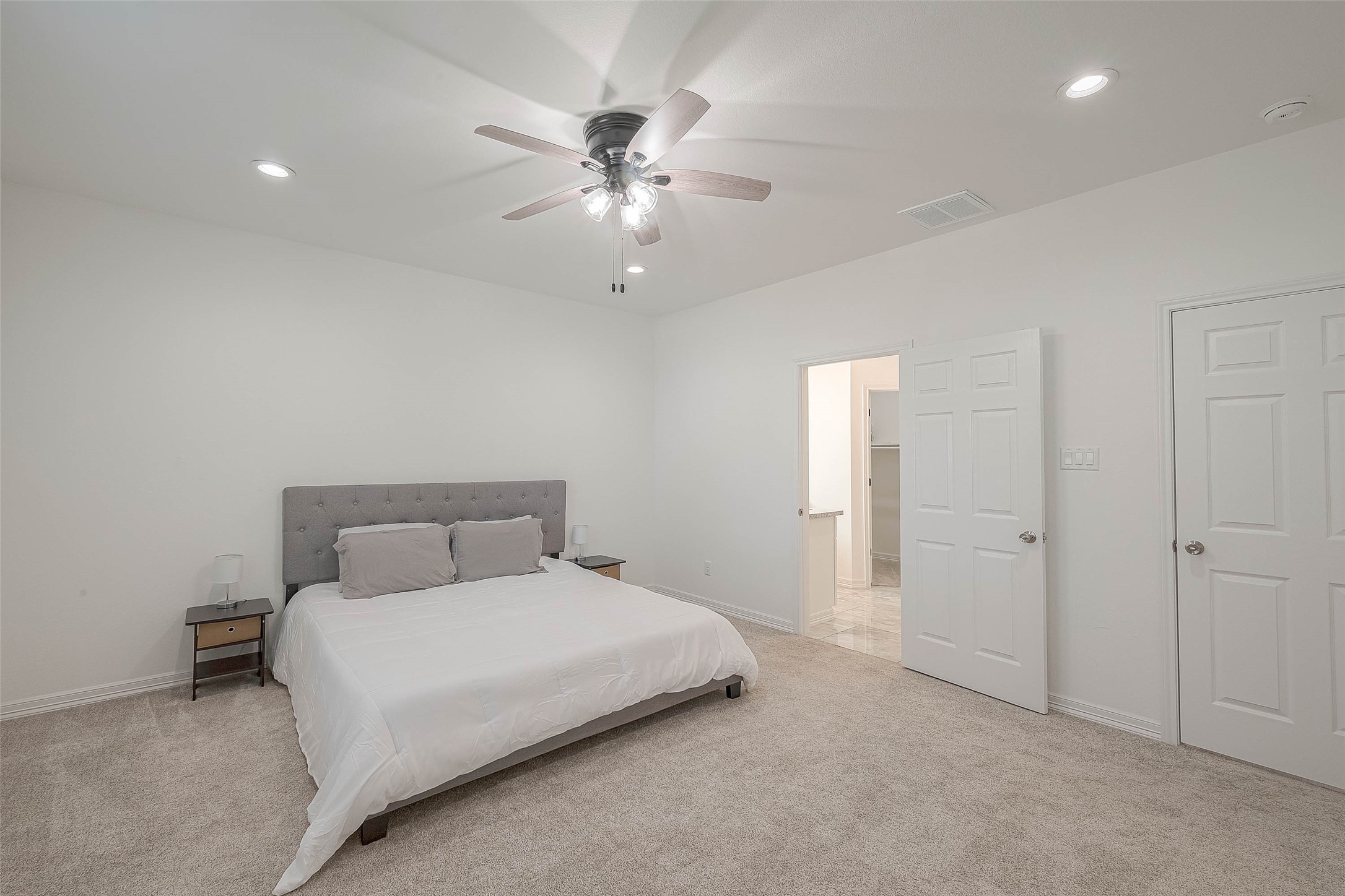 4633 Larkspur Street Houston, TX 77051 - Photo 7 of 48 a bedroom with a bed and a chandelier
