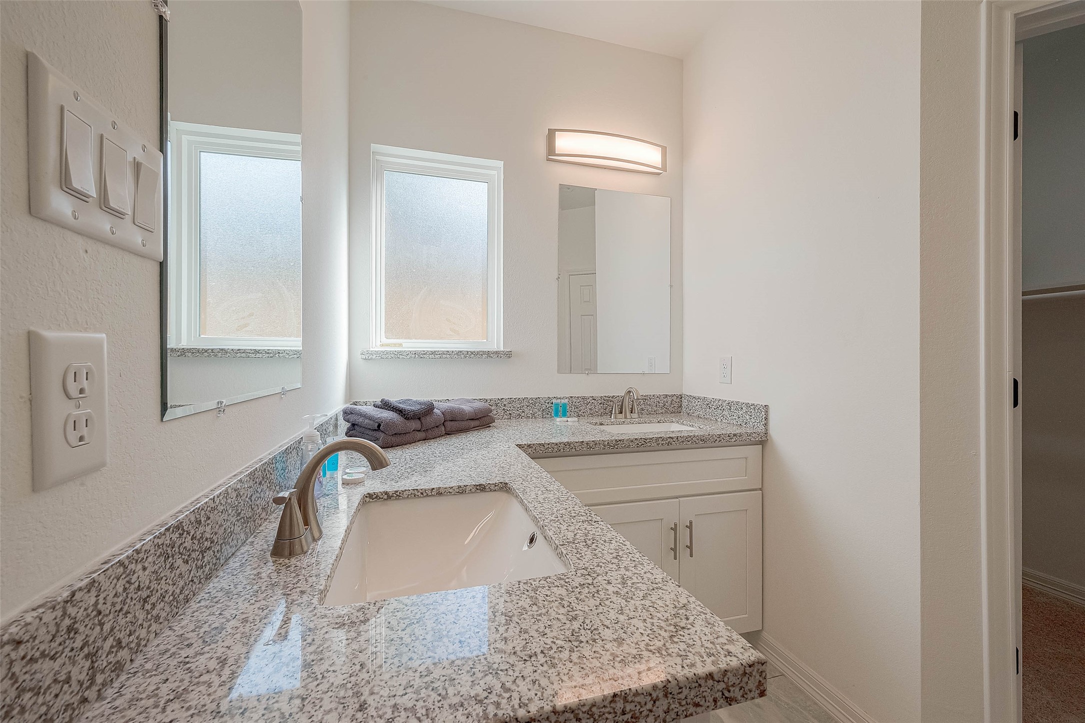 4633 Larkspur Street Houston, TX 77051 - Photo 9 of 48 a bathroom with a granite countertop sink a mirror and a