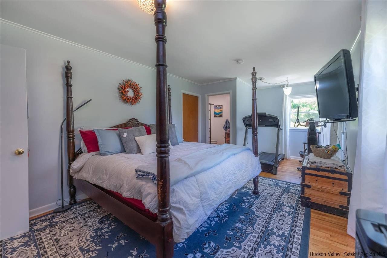 84 Benner Road Red Hook, NY 12571 - Photo 16 of 33 a bedroom with bed and a flat screen tv