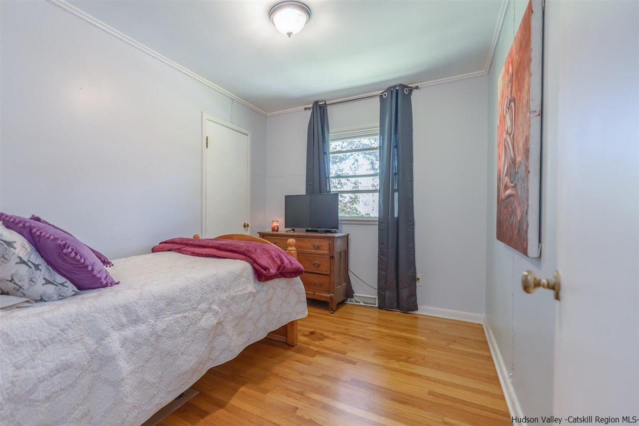 84 Benner Road Red Hook, NY 12571 - Photo 23 of 33 a bedroom with a bed and a window